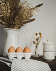 This ceramic half dozen egg holder makes cooking eggs instagram worthy and fun.
