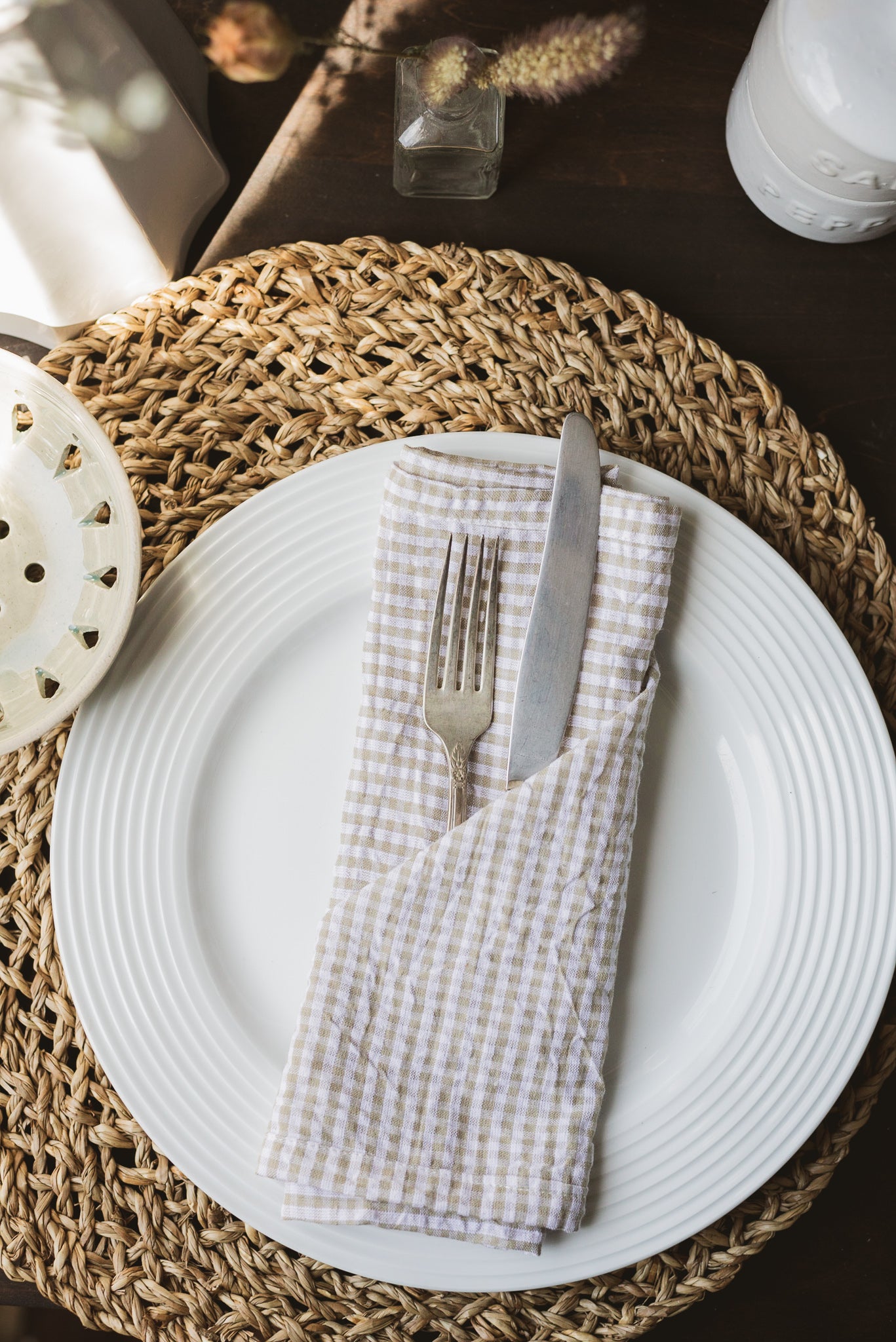 Off-white cotton with a warm neutral gingham pattern makes for a cozy yet polished everyday napkin. 