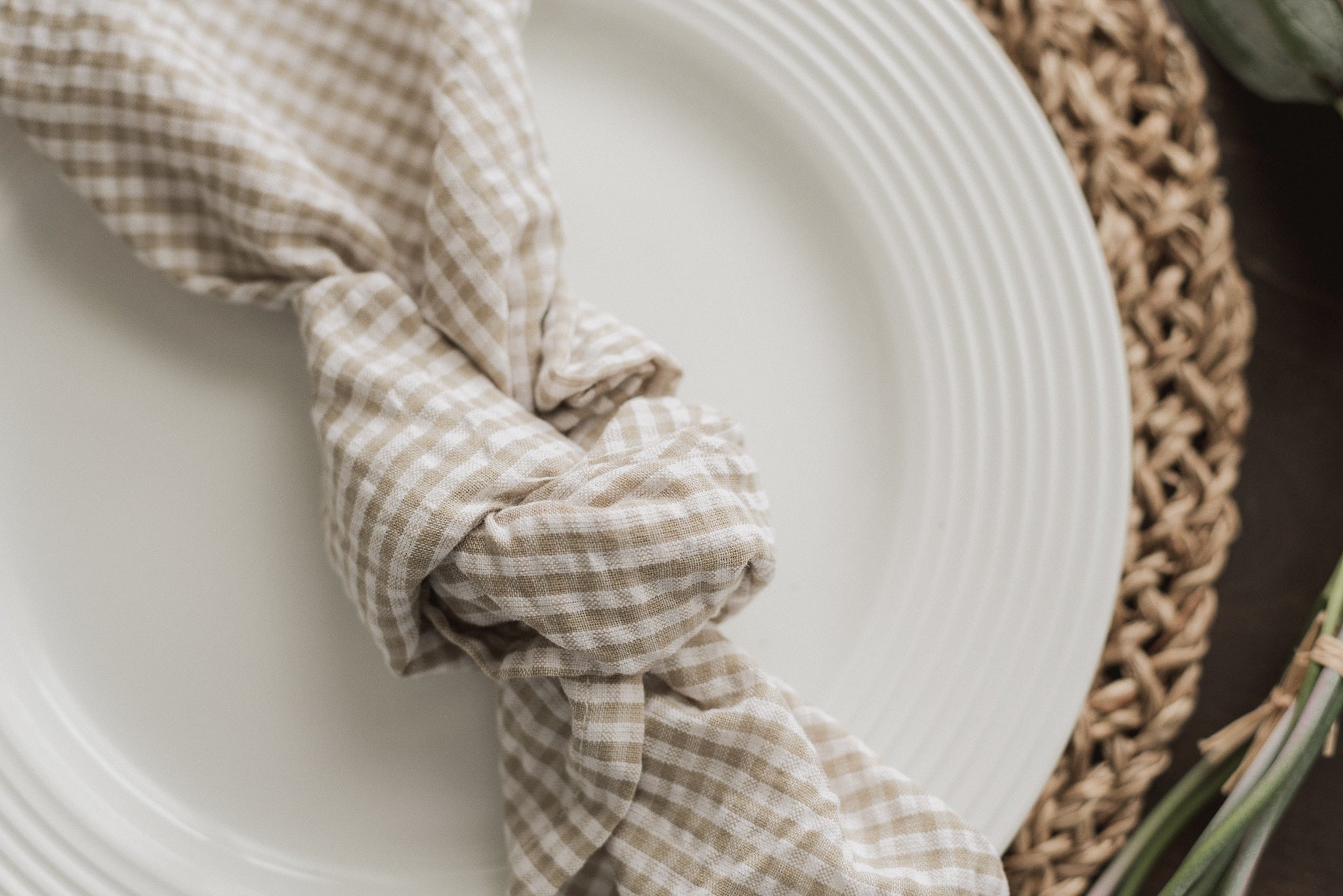 Off-white cotton with a warm neutral gingham pattern makes for a cozy yet polished everyday napkin. 