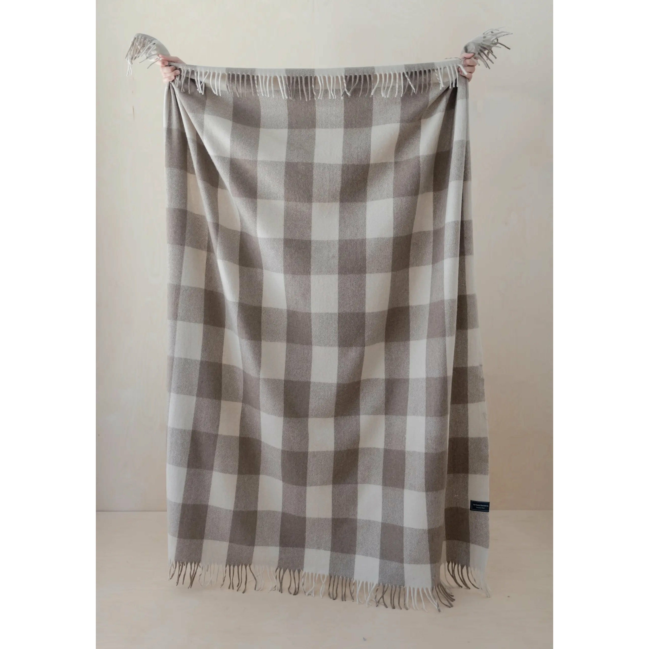 Neutral Cream Buffalo Check Blanket made from recycled wool and recycled fibres. Eco-friendly wool blanket that is machine washable. Tartan Blanket Co. Cream Buffalo Check Blanket. Jacob Tartan.